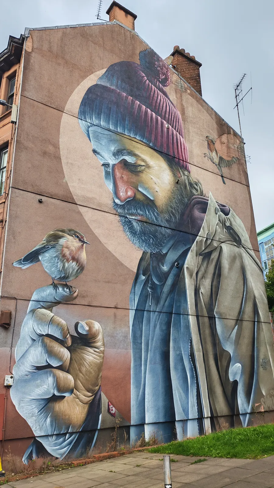Murale di St Mungo sulla High Street di Glasgow